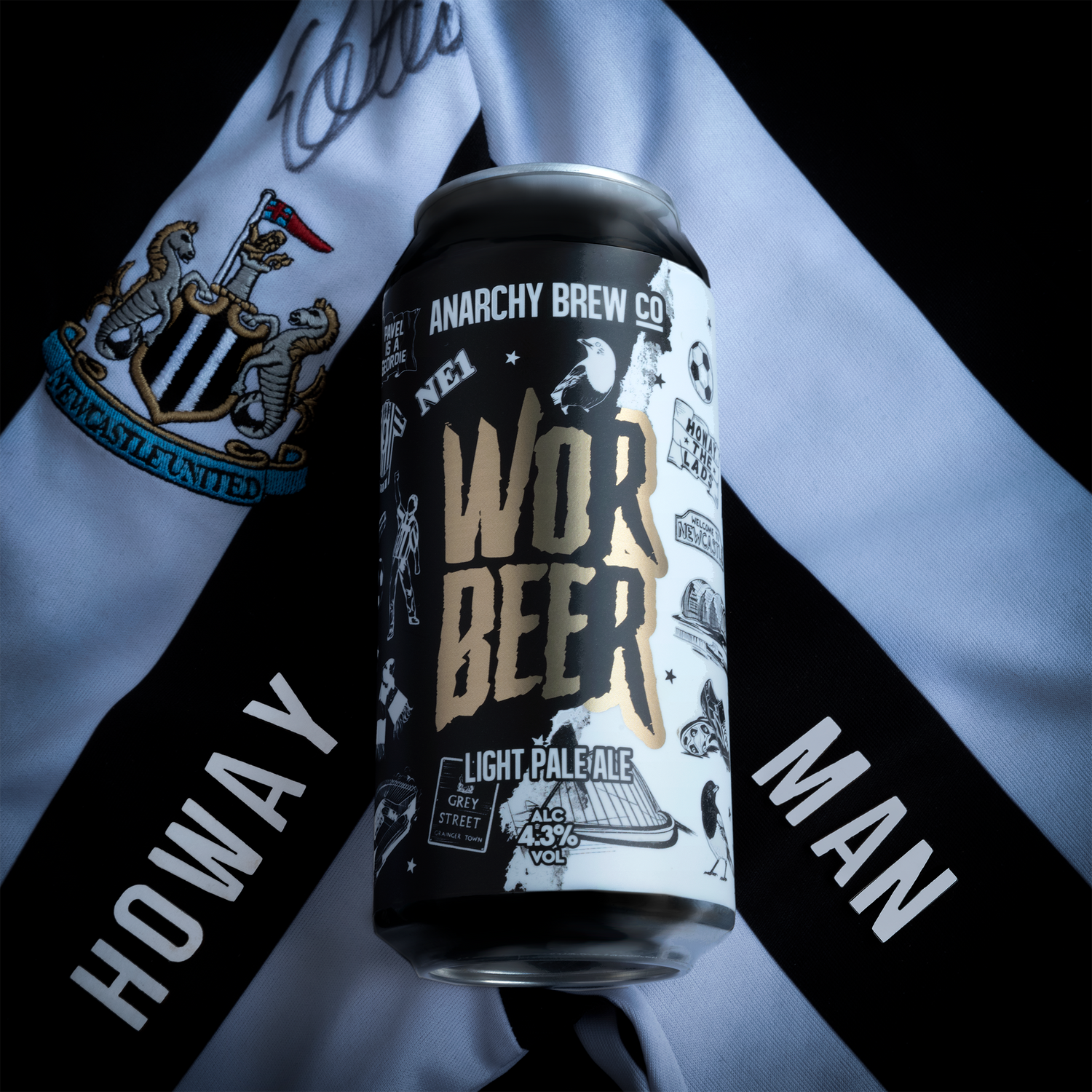 a can of anarchy brewery wor beer on a newcastle united shirt with the words howay man