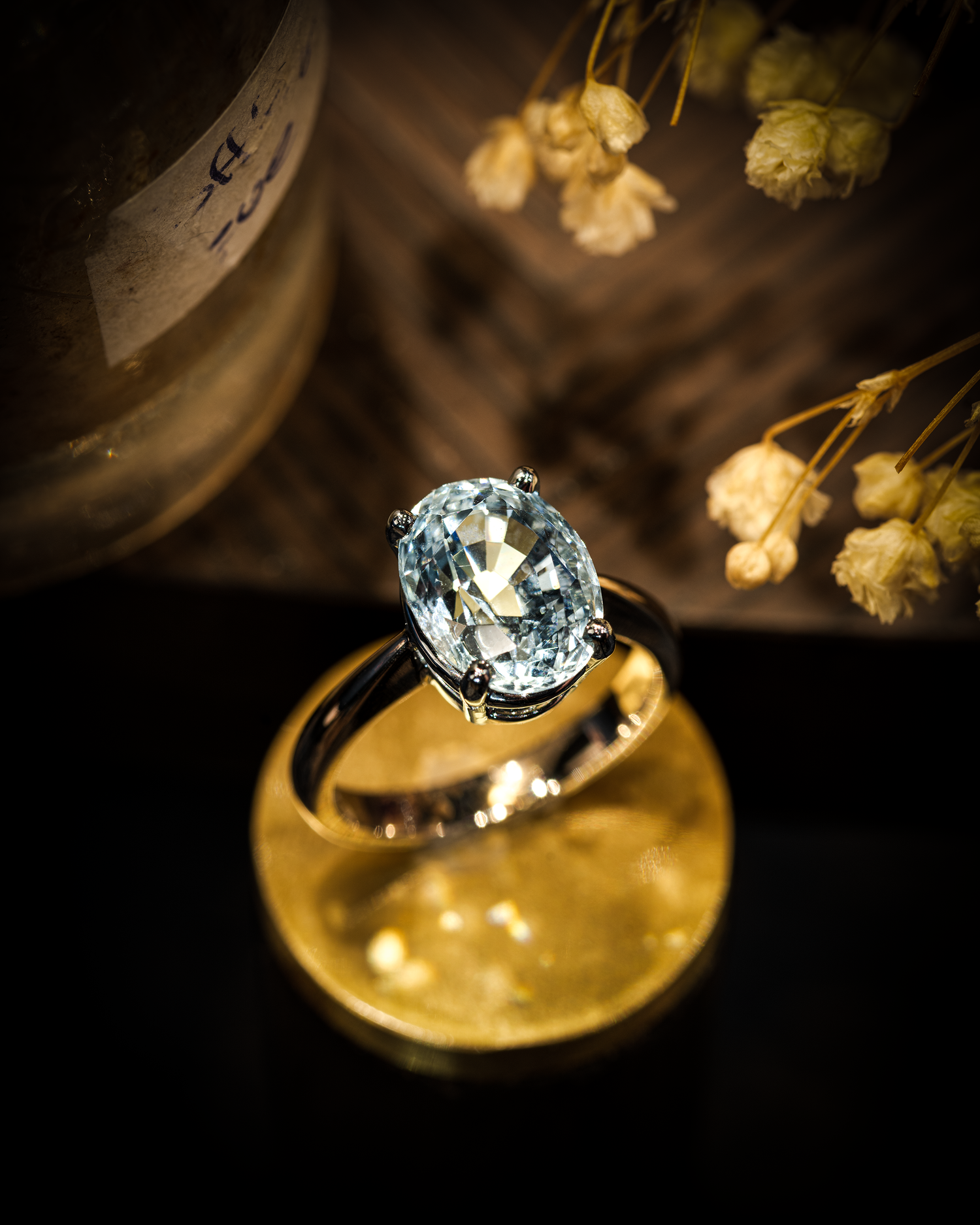 A large aquamarine solitaire on a dark background