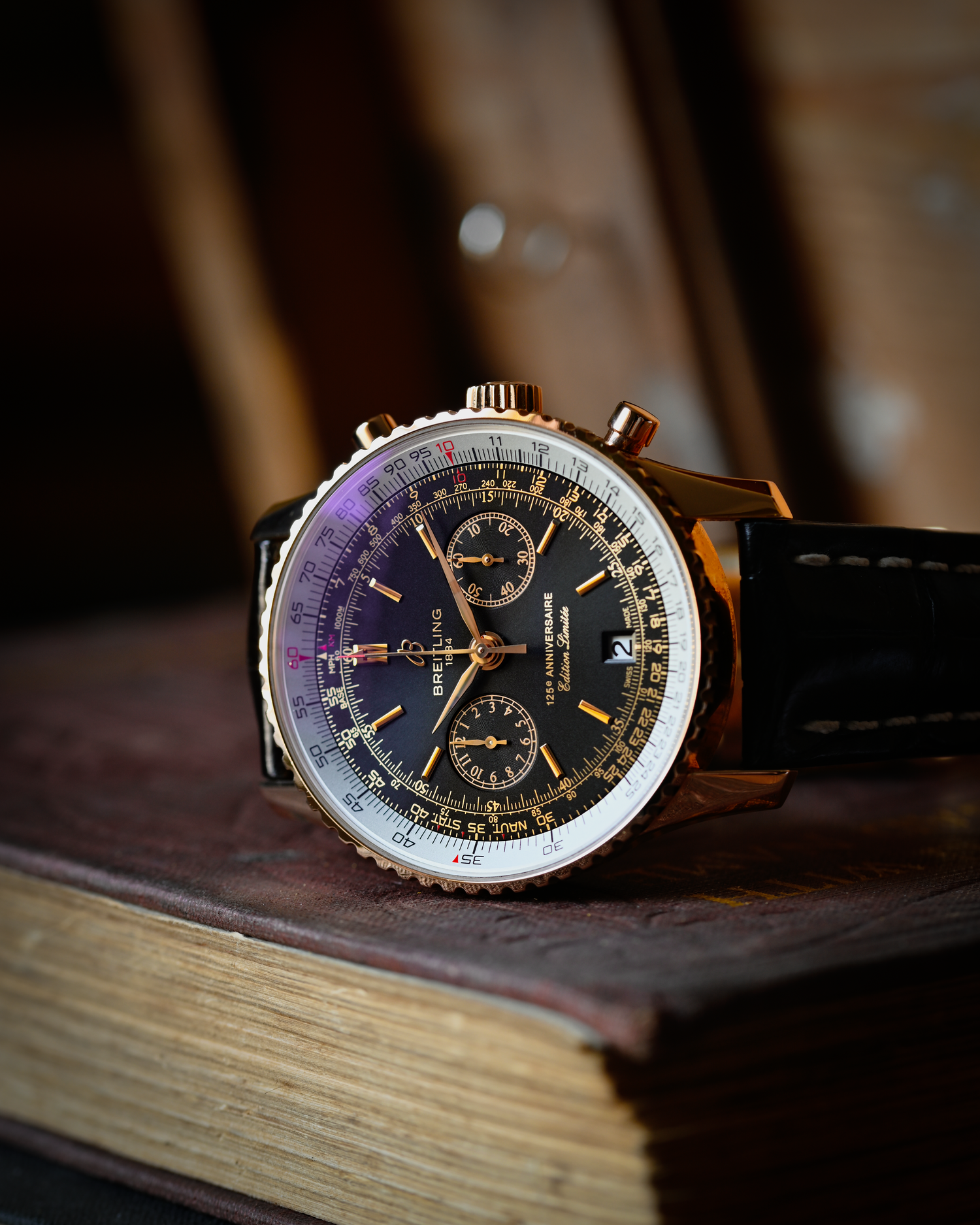 A breitling navitimer with black dial