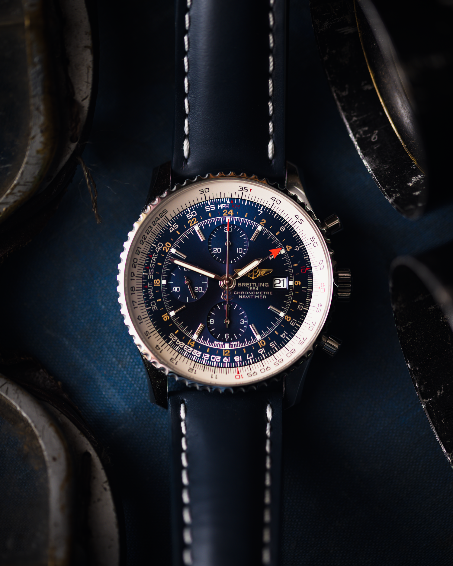 A breitling navitimer with blue dial