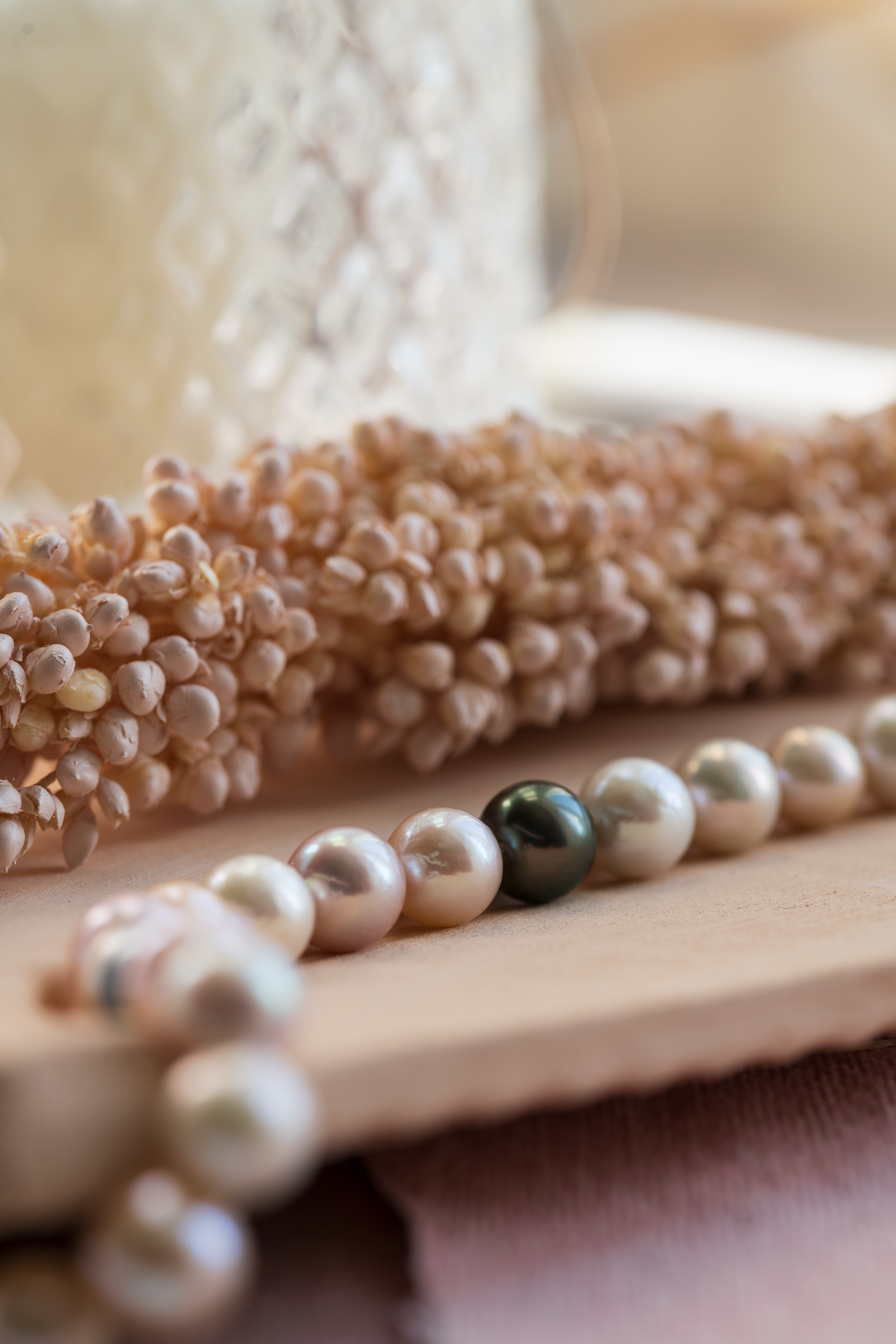 String of South Sea Pearls photographed with pink accents