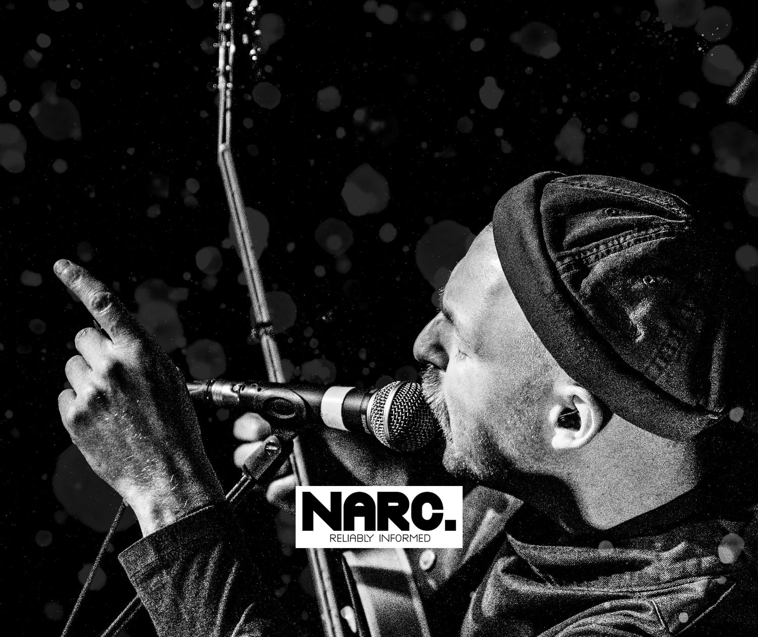 Hector Gannet singing into a microphone used for 'NARC' Magazine. Music Photography.