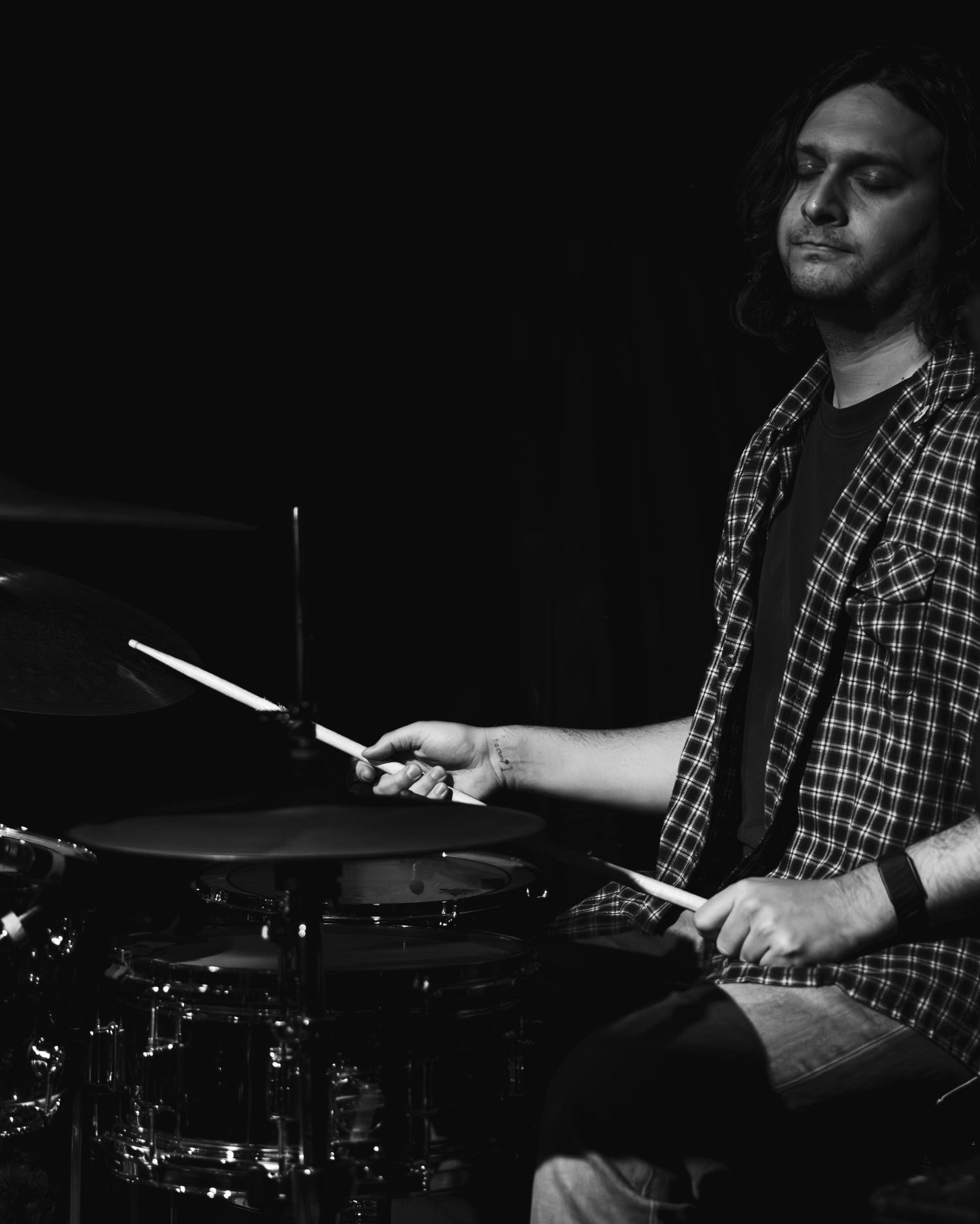 Drew Michael playing drums